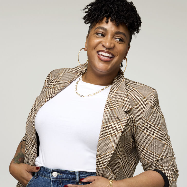 Woman looking sideways and laughing